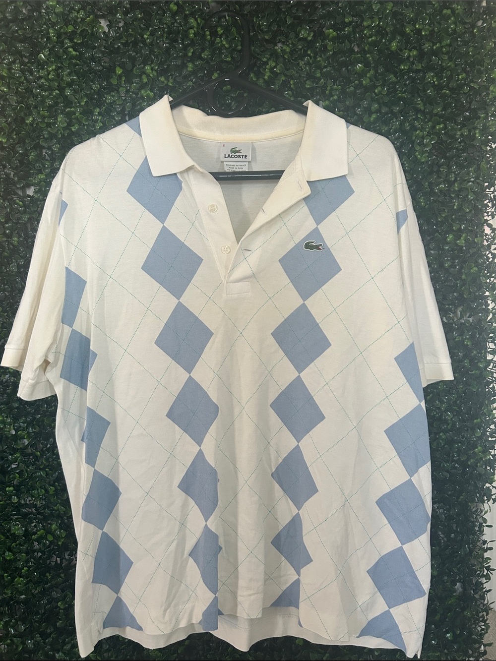 Lacoste White Polo with Light Blue Argyle Pattern